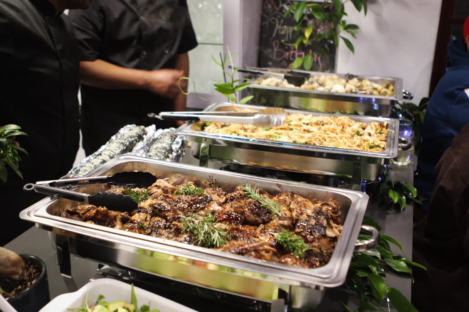 Chef serving buffet for guests